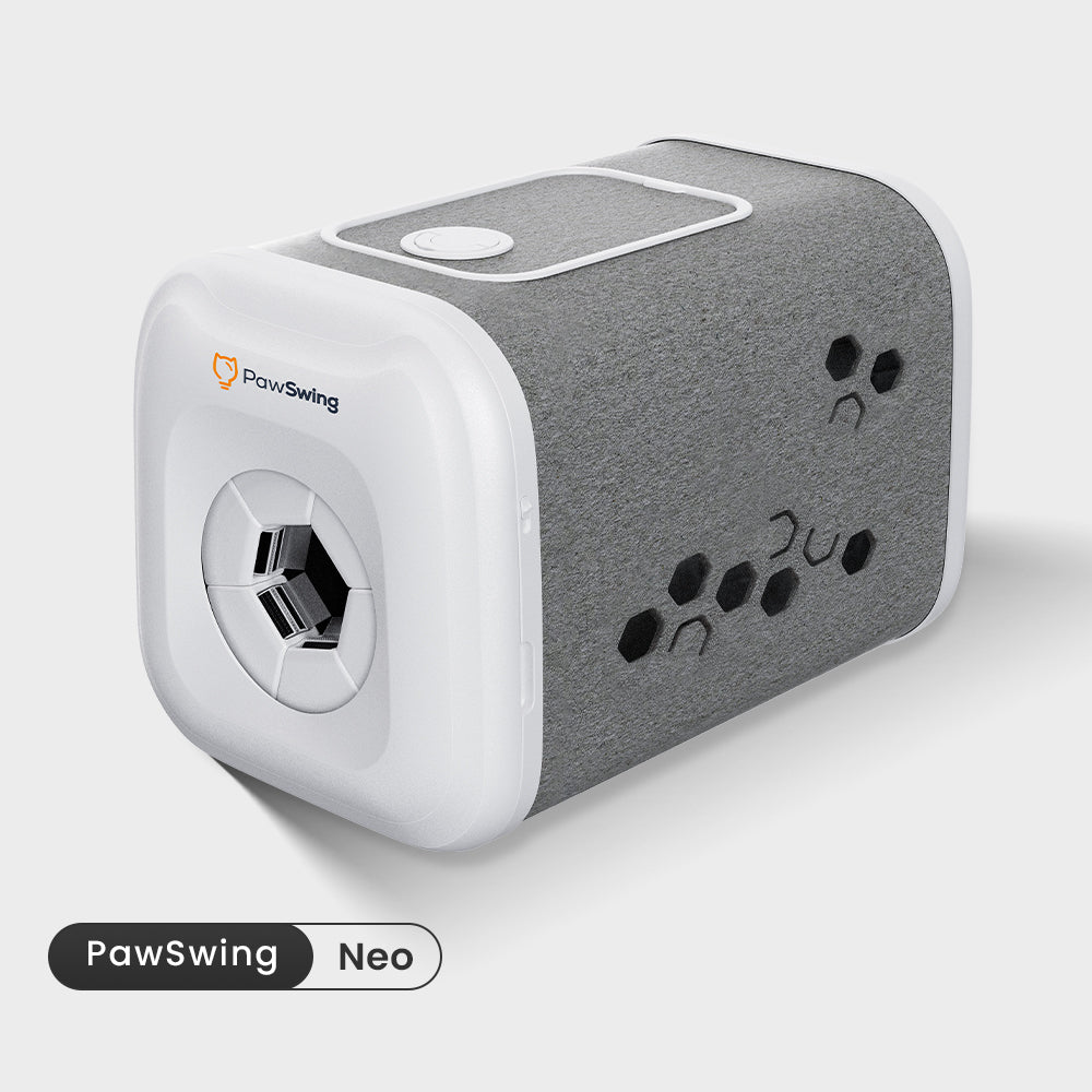 PawSwing Neo produktbild, vitt hölje med grå filtsida och borstmekanismen synlig i öppningen